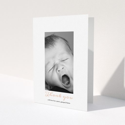 A christening thank you card template titled 'Central Portrait'. It is an A5 card in a portrait orientation. It is a photographic christening thank you card with room for 1 photo. 'Central Portrait' is available as a folded card, with tones of white and pink.