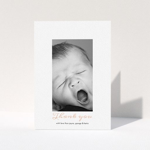 A christening thank you card design called "Central Portrait". It is an A6 card in a portrait orientation. It is a photographic christening thank you card with room for 1 photo. "Central Portrait" is available as a folded card, with tones of white and pink.