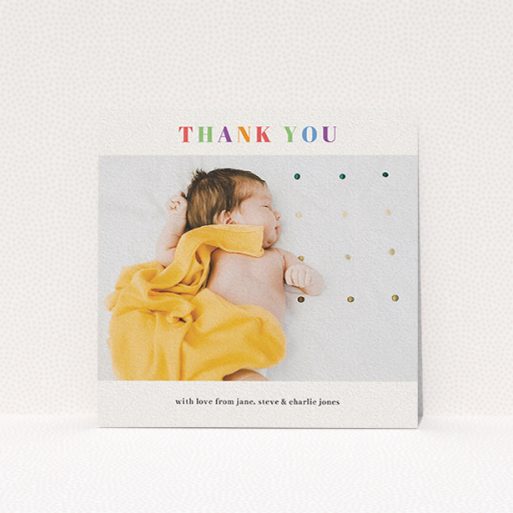 A christening thank you card called "Colourful Thanks". It is a square (148mm x 148mm) card in a square orientation. It is a photographic christening thank you card with room for 1 photo. "Colourful Thanks" is available as a flat card, with tones of white and orange.