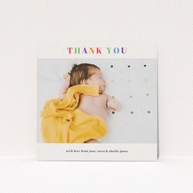 A christening thank you card called "Colourful Thanks". It is a square (148mm x 148mm) card in a square orientation. It is a photographic christening thank you card with room for 1 photo. "Colourful Thanks" is available as a flat card, with tones of white and orange.