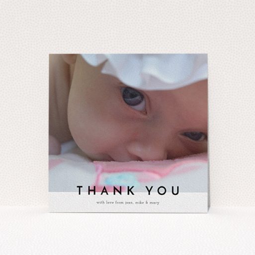 A christening thank you card design titled "Cross Border". It is a square (148mm x 148mm) card in a square orientation. It is a photographic christening thank you card with room for 1 photo. "Cross Border" is available as a flat card, with mainly white colouring.