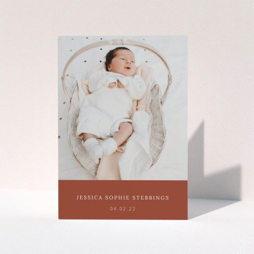 Christening Thank You Card Design - "Dark Ochre Footer" A christening thank you card design named "Dark Ochre Footer". It is an A5 card in a portrait orientation. It is a photographic christening thank you card with room for 1 photo. "Dark Ochre Footer" is available as a folded card, with mainly dark orange colouring.