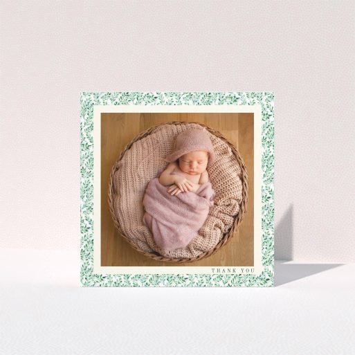 A christening thank you card design named "Hedgerow Frame". It is a square (148mm x 148mm) card in a square orientation. It is a photographic christening thank you card with room for 1 photo. "Hedgerow Frame" is available as a folded card, with tones of green and white.
