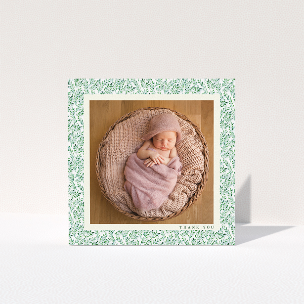 A christening thank you card design named "Hedgerow Frame". It is a square (148mm x 148mm) card in a square orientation. It is a photographic christening thank you card with room for 1 photo. "Hedgerow Frame" is available as a folded card, with tones of green and white.