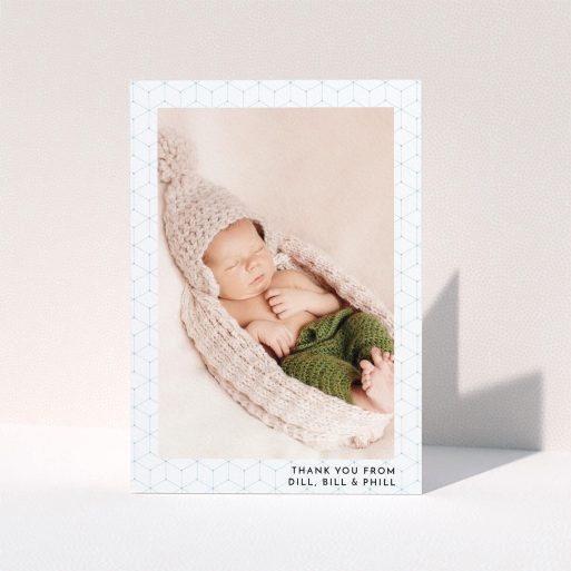A christening thank you card called "Isometric Frame". It is an A6 card in a portrait orientation. It is a photographic christening thank you card with room for 1 photo. "Isometric Frame" is available as a folded card, with mainly blue colouring.