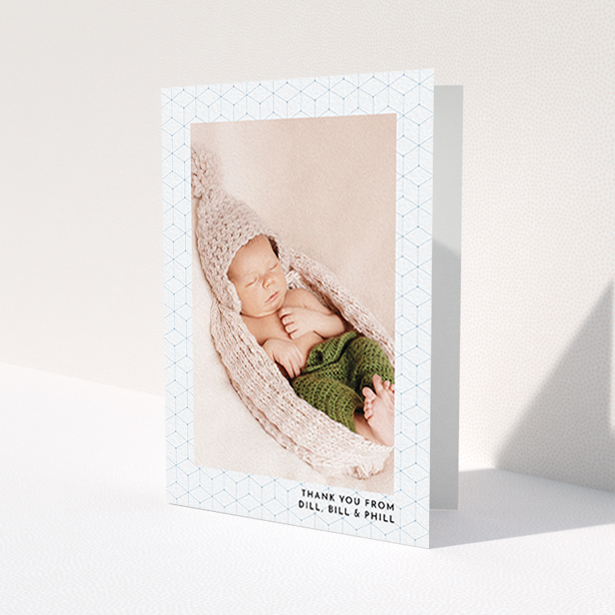 A christening thank you card called "Isometric Frame". It is an A6 card in a portrait orientation. It is a photographic christening thank you card with room for 1 photo. "Isometric Frame" is available as a folded card, with mainly blue colouring.