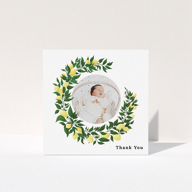 A christening thank you card called "Lemon Wreath". It is a square (148mm x 148mm) card in a square orientation. It is a photographic christening thank you card with room for 1 photo. "Lemon Wreath" is available as a folded card, with tones of green and yellow.