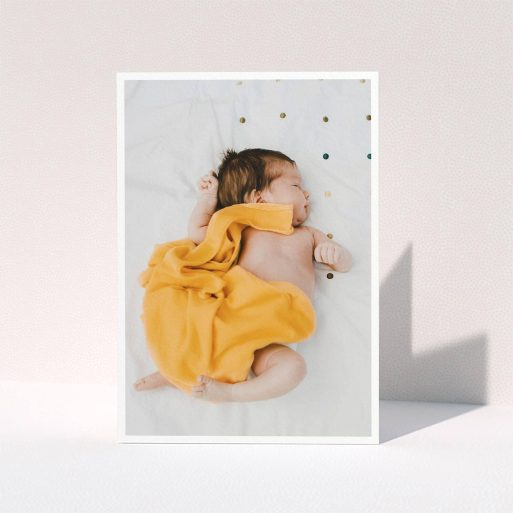 A christening thank you card design called "One Photo Thanks". It is an A5 card in a portrait orientation. It is a photographic christening thank you card with room for 1 photo. "One Photo Thanks" is available as a folded card, with mainly white colouring.