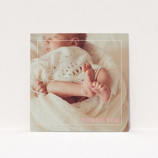 A christening thank you card design named "Over Photo Frame". It is a square (148mm x 148mm) card in a square orientation. It is a photographic christening thank you card with room for 1 photo. "Over Photo Frame" is available as a flat card, with mainly light pink colouring.