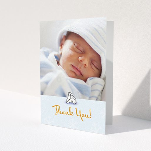 A christening thank you card design named 'Polar Picture'. It is an A6 card in a portrait orientation. It is a photographic christening thank you card with room for 1 photo. 'Polar Picture' is available as a folded card, with tones of blue and white.