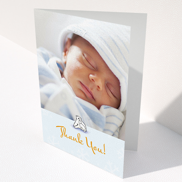 A christening thank you card design named "Polar Picture". It is an A6 card in a portrait orientation. It is a photographic christening thank you card with room for 1 photo. "Polar Picture" is available as a folded card, with tones of blue and white.
