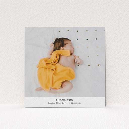 A christening thank you card called "Sans Serif". It is a square (148mm x 148mm) card in a square orientation. It is a photographic christening thank you card with room for 1 photo. "Sans Serif" is available as a flat card, with mainly white colouring.