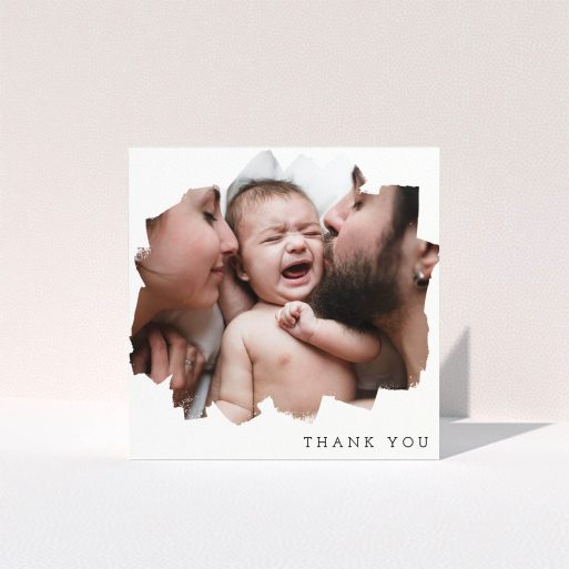 A christening thank you card named "Scratched Banner". It is a square (148mm x 148mm) card in a square orientation. It is a photographic christening thank you card with room for 1 photo. "Scratched Banner" is available as a folded card, with mainly white colouring.