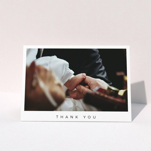A christening thank you card template titled "Simple Thanks". It is an A6 card in a landscape orientation. It is a photographic christening thank you card with room for 1 photo. "Simple Thanks" is available as a folded card, with mainly white colouring.