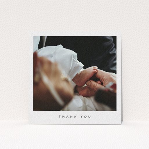 A christening thank you card template titled "Simple Thanks". It is a square (148mm x 148mm) card in a square orientation. It is a photographic christening thank you card with room for 1 photo. "Simple Thanks" is available as a flat card, with mainly white colouring.