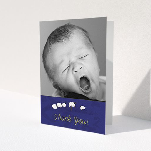 A christening thank you card design titled 'Sleepy Time'. It is an A6 card in a portrait orientation. It is a photographic christening thank you card with room for 1 photo. 'Sleepy Time' is available as a folded card, with tones of blue and white.