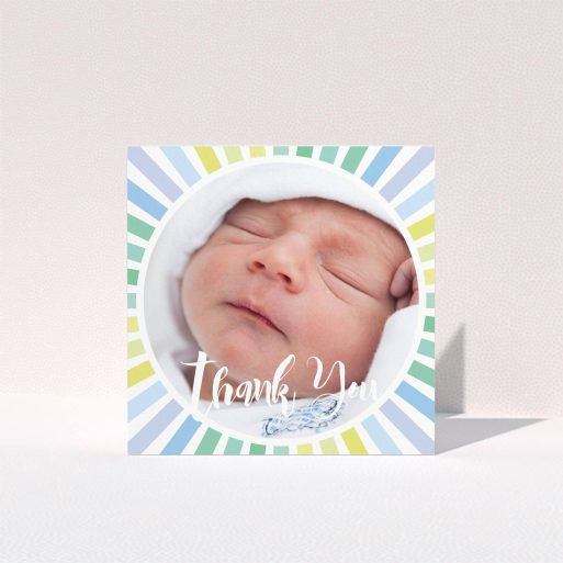 A christening thank you card template titled "Sun Centre". It is a square (148mm x 148mm) card in a square orientation. It is a photographic christening thank you card with room for 1 photo. "Sun Centre" is available as a folded card, with mainly light blue colouring.