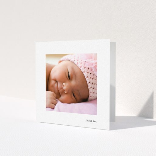 A christening thank you card design named 'Thank You!'. It is a square (148mm x 148mm) card in a square orientation. It is a photographic christening thank you card with room for 1 photo. 'Thank You!' is available as a folded card, with mainly white colouring.