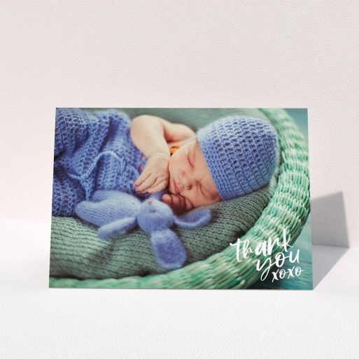 A christening thank you card design called "Thanks In the Corner". It is an A5 card in a landscape orientation. It is a photographic christening thank you card with room for 1 photo. "Thanks In the Corner" is available as a folded card, with mainly white colouring.