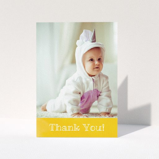 A christening thank you card template titled "Thanks In Yellow". It is an A6 card in a portrait orientation. It is a photographic christening thank you card with room for 1 photo. "Thanks In Yellow" is available as a folded card, with tones of yellow and white.