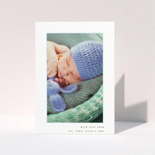 A christening thank you card named "Thin Blue Frame". It is an A5 card in a portrait orientation. It is a photographic christening thank you card with room for 1 photo. "Thin Blue Frame" is available as a folded card, with tones of white and blue.