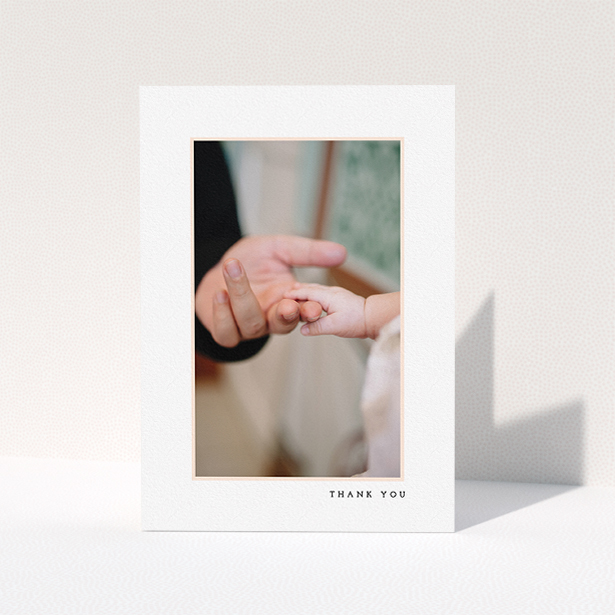 A christening thank you card called "Thin Pink Frame". It is an A5 card in a portrait orientation. It is a photographic christening thank you card with room for 1 photo. "Thin Pink Frame" is available as a folded card, with tones of white and pink.
