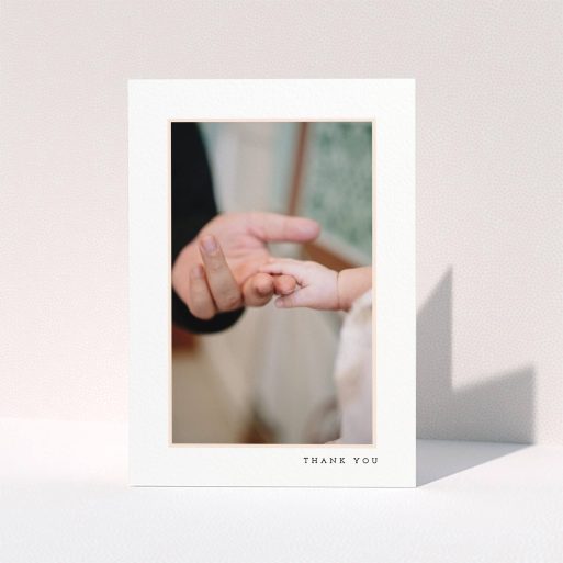 A christening thank you card template titled "Thin Pink Frame". It is an A6 card in a portrait orientation. It is a photographic christening thank you card with room for 1 photo. "Thin Pink Frame" is available as a folded card, with tones of white and pink.