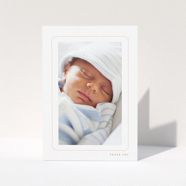 A christening thank you card design named "Thin Pink". It is an A5 card in a portrait orientation. It is a photographic christening thank you card with room for 1 photo. "Thin Pink" is available as a folded card, with tones of white and pink.