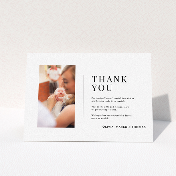 A christening thank you card template titled "Tiny Portrait". It is an A6 card in a landscape orientation. It is a photographic christening thank you card with room for 1 photo. "Tiny Portrait" is available as a folded card, with mainly white colouring.