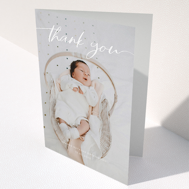 A christening thank you card called "Topped and Bottomed". It is an A5 card in a portrait orientation. It is a photographic christening thank you card with room for 1 photo. "Topped and Bottomed" is available as a folded card, with mainly white colouring.