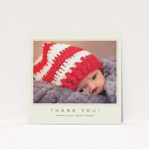 A christening thank you card design named "Torn Cream Frame". It is a square (148mm x 148mm) card in a square orientation. It is a photographic christening thank you card with room for 1 photo. "Torn Cream Frame" is available as a flat card, with mainly cream colouring.