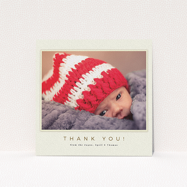 A christening thank you card design named "Torn Cream Frame". It is a square (148mm x 148mm) card in a square orientation. It is a photographic christening thank you card with room for 1 photo. "Torn Cream Frame" is available as a flat card, with mainly cream colouring.