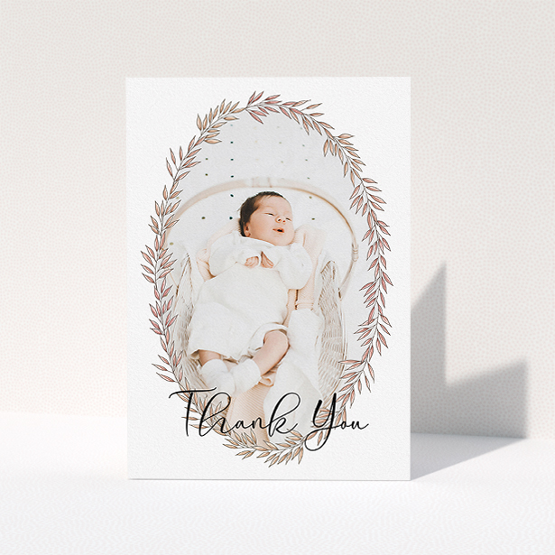 A christening thank you card design titled "Tussled Wreath". It is an A5 card in a portrait orientation. It is a photographic christening thank you card with room for 1 photo. "Tussled Wreath" is available as a folded card, with tones of pink and white.