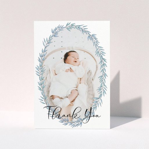 Christening Thank You Card - Tussled Wreath (Baby Boy) A christening thank you card design titled "Tussled Wreath". It is an A6 card in a portrait orientation. It is a photographic christening thank you card with room for 1 photo. "Tussled Wreath" is available as a folded card, with tones of blue and white.