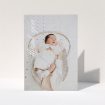 A christening thank you card named "Up the Side". It is an A5 card in a portrait orientation. It is a photographic christening thank you card with room for 1 photo. "Up the Side" is available as a folded card, with mainly white colouring.