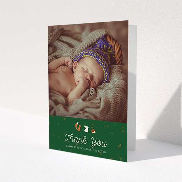 A christening thank you card design named "Woodland Chums". It is an A6 card in a portrait orientation. It is a photographic christening thank you card with room for 1 photo. "Woodland Chums" is available as a folded card, with tones of green and white.