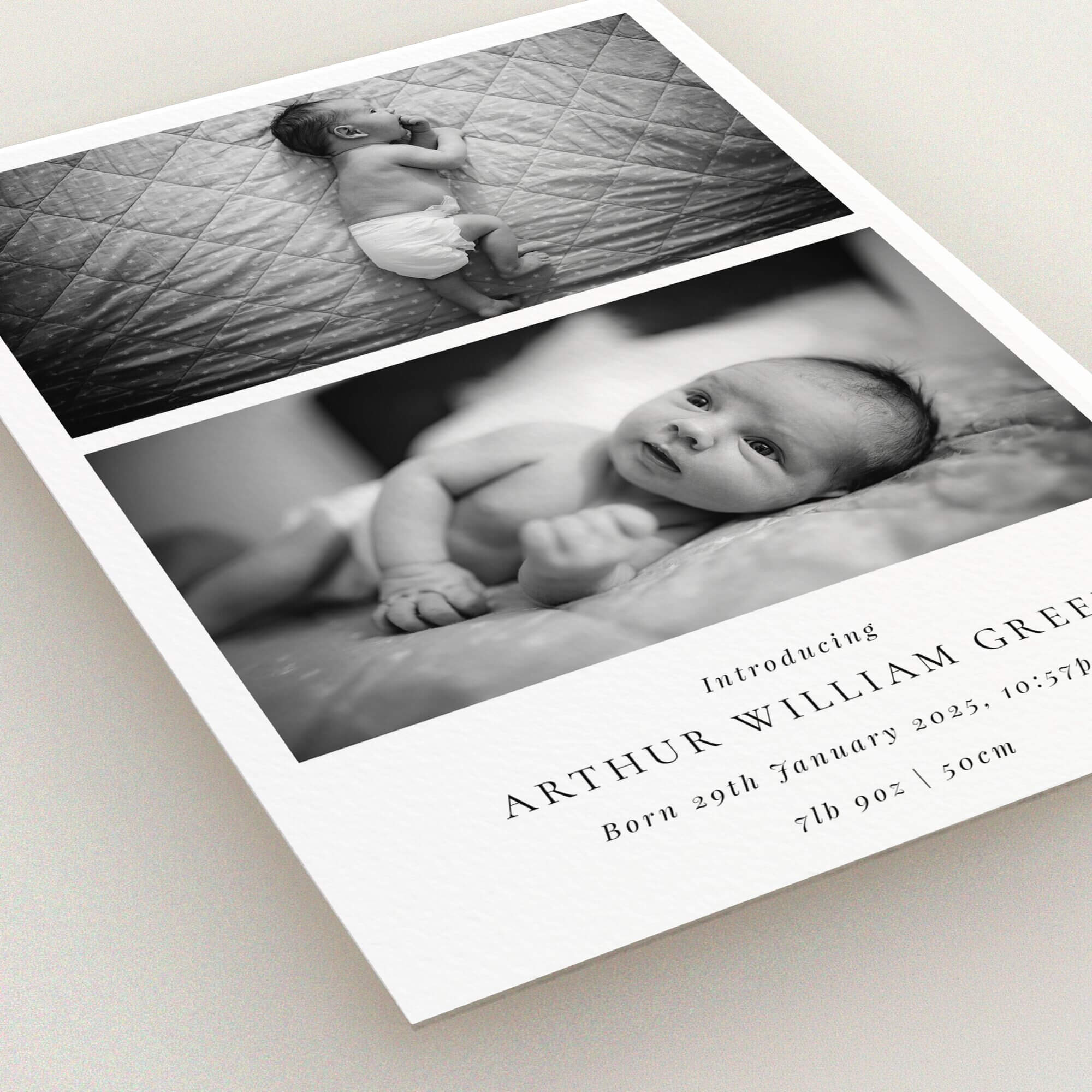 Black and white birth announcement card with two photos of a newborn baby