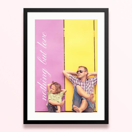 Framed and mounted photo print with two people relaxing against a colourful background.