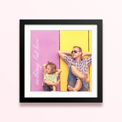 Framed and mounted photo print with two people relaxing against a colourful background.