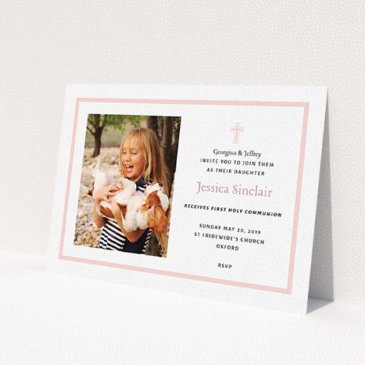 A communion invitation template titled 'Baby Pink Cross'. It is an A6 invite in a landscape orientation. It is a photographic communion invitation with room for 1 photo. 'Baby Pink Cross' is available as a flat invite, with tones of pink and white.