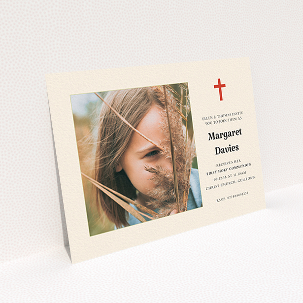 A communion invitation template titled "Red Cross". It is an A6 invite in a landscape orientation. It is a photographic communion invitation with room for 1 photo. "Red Cross" is available as a flat invite, with tones of red and cream.