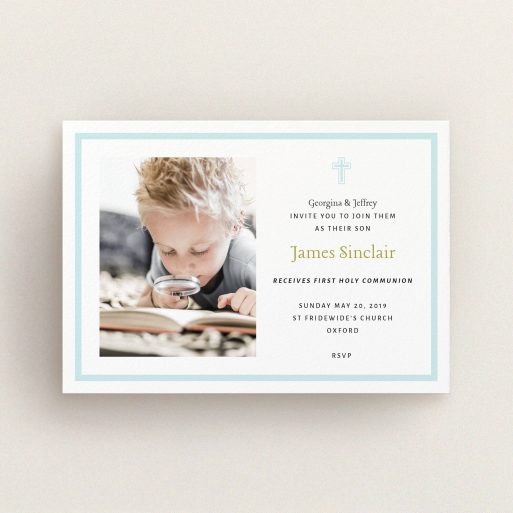 Communion Invite Card Design - "Baby Blue Cross" A communion invite card called "Baby Blue Cross". It is an A6 invite in a landscape orientation. It is a photographic communion invite card with room for 1 photo. "Baby Blue Cross" is available as a flat invite, with tones of blue and white.