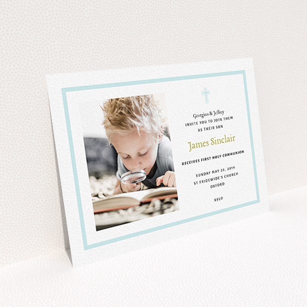 A communion invite card called "Baby Blue Cross". It is an A6 invite in a landscape orientation. It is a photographic communion invite card with room for 1 photo. "Baby Blue Cross" is available as a flat invite, with tones of blue and white.