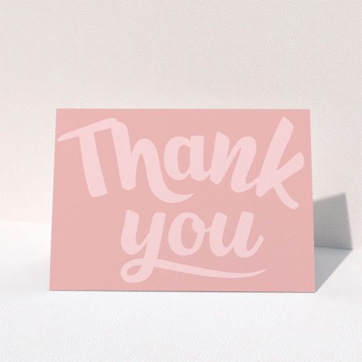 Communion Thank You Card Design - "Big Pink Typography" A communion thank you card design called "Big Pink Typography". It is an A5 card in a landscape orientation. "Big Pink Typography" is available as a folded card, with mainly pink colouring.