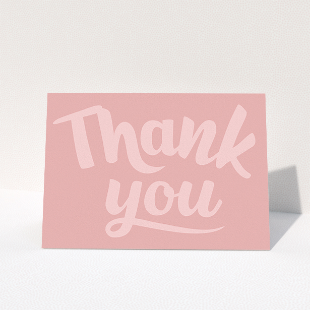 A communion thank you card design called "Big Pink Typography". It is an A5 card in a landscape orientation. "Big Pink Typography" is available as a folded card, with mainly pink colouring.