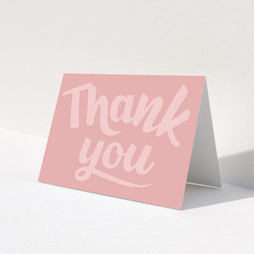 A communion thank you card design called 'Big Pink Typography'. It is an A5 card in a landscape orientation. 'Big Pink Typography' is available as a folded card, with mainly pink colouring.