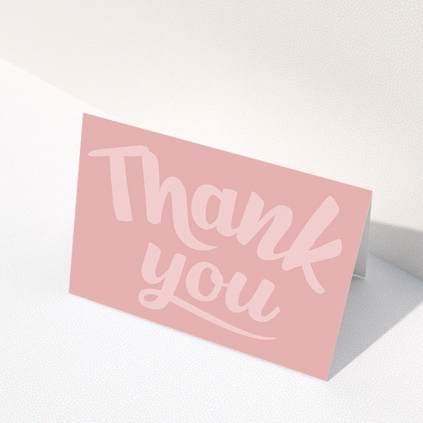 A communion thank you card design called "Big Pink Typography". It is an A5 card in a landscape orientation. "Big Pink Typography" is available as a folded card, with mainly pink colouring.