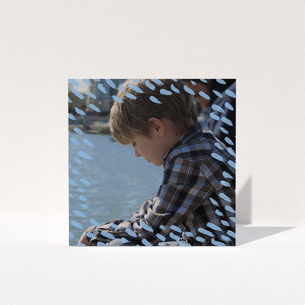 A communion thank you card called "Blue Daubs". It is a square (148mm x 148mm) card in a square orientation. It is a photographic communion thank you card with room for 1 photo. "Blue Daubs" is available as a folded card, with mainly blue colouring.