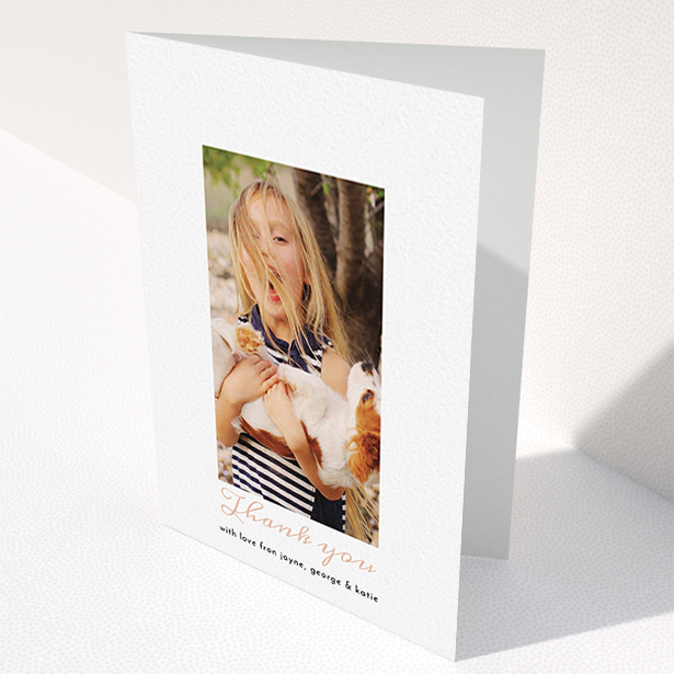 A communion thank you card template titled "Central Portrait". It is an A6 card in a portrait orientation. It is a photographic communion thank you card with room for 1 photo. "Central Portrait" is available as a folded card, with tones of white and pink.