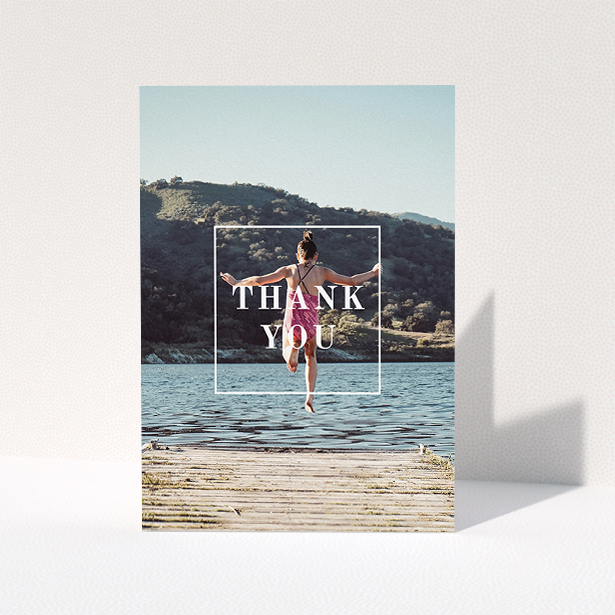 A communion thank you card template titled "Central Thanks". It is an A5 card in a portrait orientation. It is a photographic communion thank you card with room for 1 photo. "Central Thanks" is available as a folded card, with mainly white colouring.